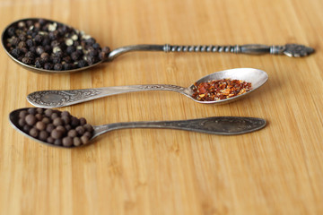 Ingredients. Different spices, pepper on three spoons