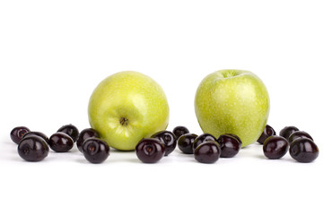 Two green apples and cherry berries on white background isolated close up macro