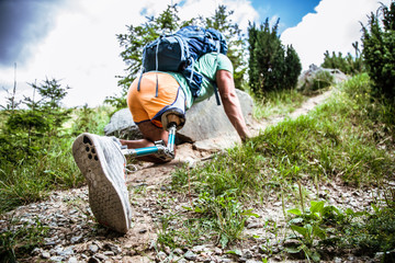 Low angle of a determined active man climbing up