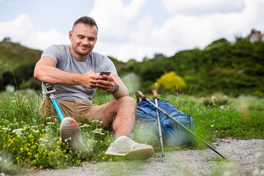 Joyful young man resting outdoors with pleasure - Powered by Adobe