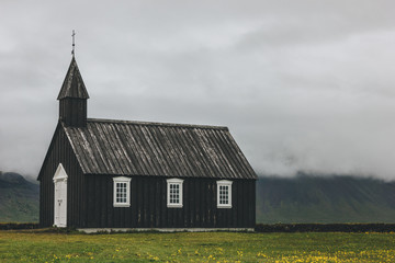 scenic shot of Budir church on green meadow at Snaefellsnes, Iceland