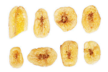 Fototapeta na wymiar Baked and dried banana chip slice isolated over the white background, set of different foreshortenings