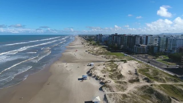 Beach and city, aerial scene in 4k, Capao da canoa city, south of Brazil.