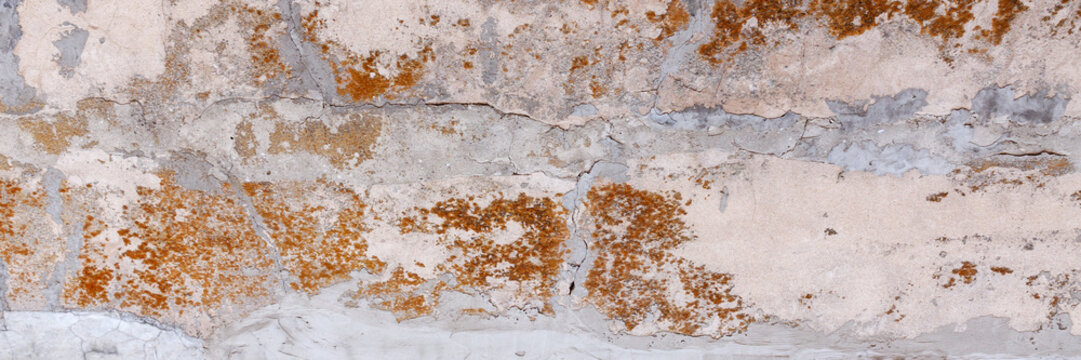 A panoramic photo of the background of an old shabby wabi sabi wall