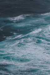 dramatic shot of ocean with foamy waves for background