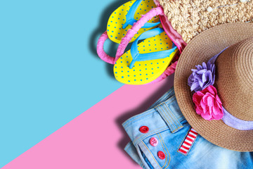 Beach accessories on pastel color background, flat lay photo