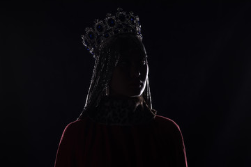 queen with crown, studio portrait on a black background