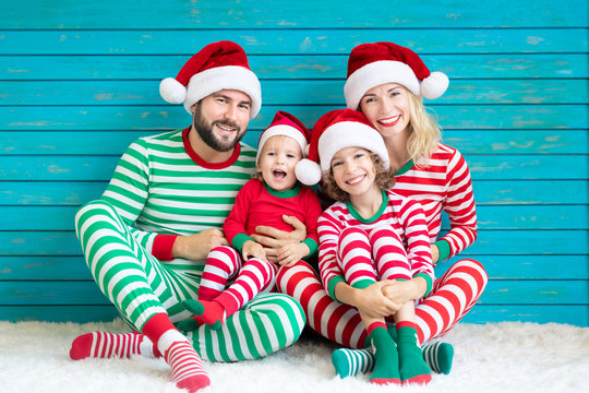 Happy family having fun at Christmas time - Powered by Adobe