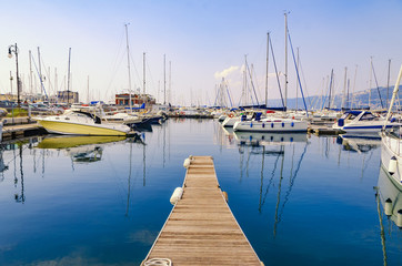 Obraz premium Pier, sailboats and yachts at marina in Triest port