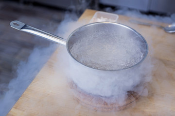 Modern way of cooking. Something really unusual and tasty is cooking