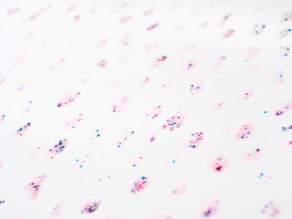 Abstract background with glitter stains with shiny sparkling rhinestones. Pink backdrop.
