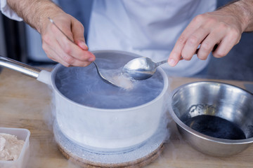 Molecular gastronomy. Talented ambitious cook feeling confident while providing innovative methods of cooking