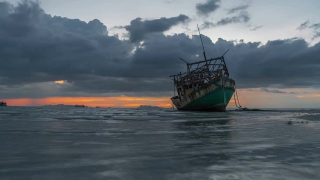 Deserted old wooden ship on the coast of a sea in Koh Samui, Thailand. Timelapse 4K