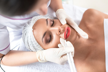 Enhancing lips appearance  on a beautiful woman