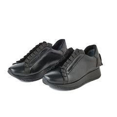 Women black sneakers isolated on white background