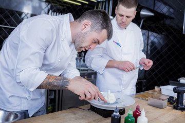 Interesting work. Handsome pleasant cooks being serious while dealing with different recipes