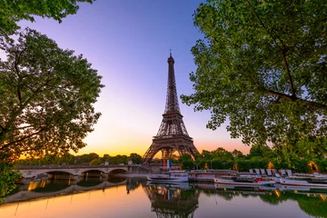 Foto op Aluminium View of Eiffel Tower and river Seine at sunrise in Paris, France. Eiffel Tower is one of the most iconic landmarks of Paris © Ekaterina Belova