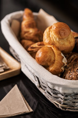 Bakery basket on a cafe tabletop. Closeup.