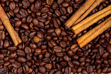 Roasted coffee beans and cinnamon sticks