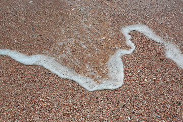 Fototapeta na wymiar foam on sand