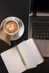Working at a cafe with latte art cappuccino.  Business meeting. Top view shot.