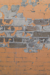 Brick wall with peeling paint