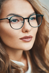 Fashionable eyewear model close-up portrait wearing transparent