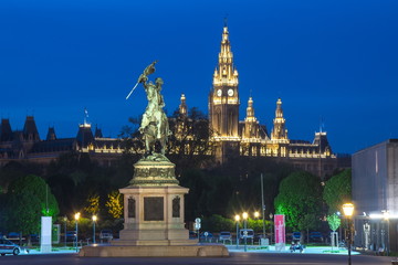 Fototapeta na wymiar Statue of Archduke Charles and Vienna City hall at night, Austria
