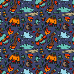 Autumn seamless pattern. Autumn background. The sweater, scarf, boots, cup of coffee, puddles, clouds, leaves
