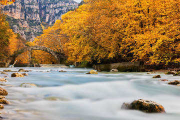Old stone bridge in Klidonia Zagoria, Epirus, Western Greece. This arch bridge with elongated arch built in 1853.(Soft Focus) Long exposure using ND filter