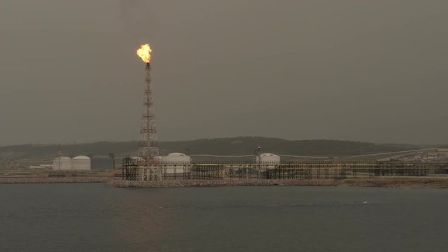 LNG tanker loading on jetty of petrochemical terminal