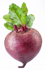 Red beet or beetroot with green leaves on white background.