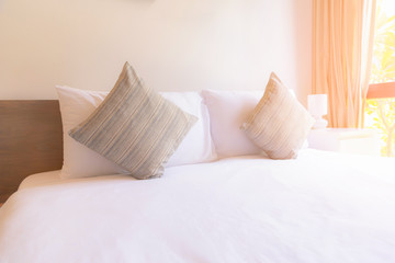 Pillow on the bed with sunlight.