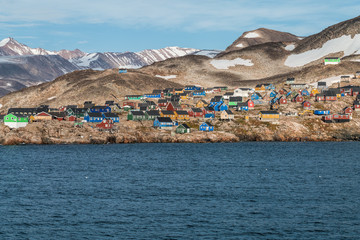 settlement of Ittoqqortoormiit with colorful houses, eastern Greenland at the entrance to the...