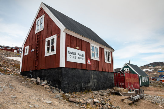 tourist office of Ittoqqortoormiit with colorful houses, eastern Greenland at the entrance to the Scoresby Sound fjords