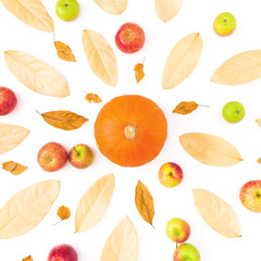 Autumn pattern with dried fall leaves, apples and pumpkin on white background. Flat lay, top view