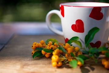 A cup of coffee with fall decoration