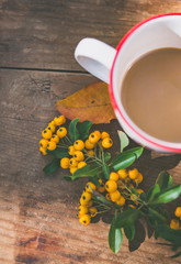 A cup of coffee with fall decoration