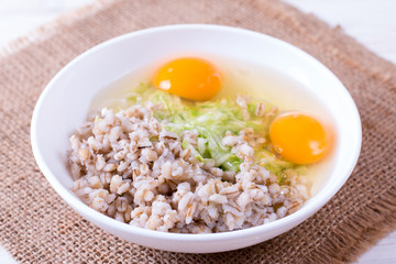 Grated zucchini with egg and porridge