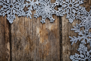 Christmas  snowflakes on a wooden background