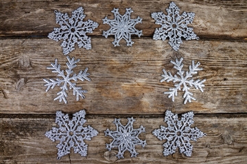 Christmas  snowflakes on a wooden background