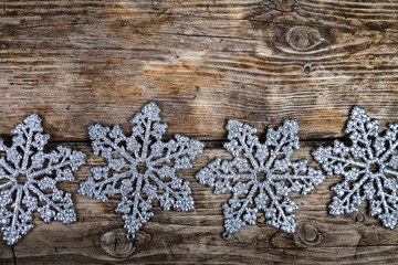 Christmas  snowflakes on a wooden background