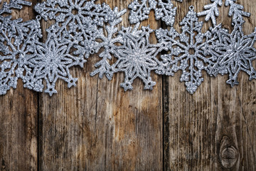 Christmas  snowflakes on a wooden background