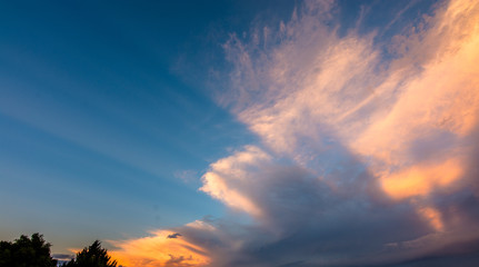Naklejka premium Light rays through clouds