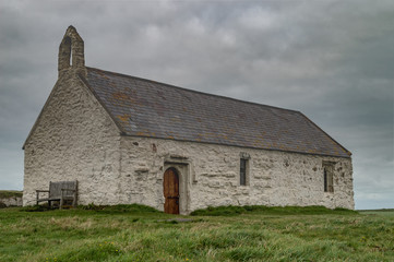 Fototapeta na wymiar St Cwyfan's Church, the church in the sea, Anglesey.