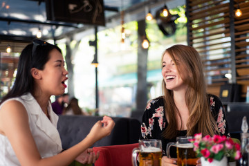 Female friends having a talk in a restaurant
