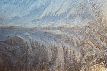 Ice frosty patterns on the winter window glass