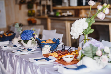 Table set up with variety of cheese and meat