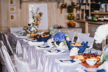 Table set up with variety of cheese and meat