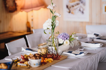 Table set up with variety of cheese and meat